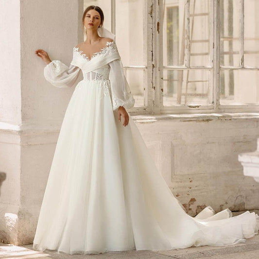 Robe de mariee princesse manche longue dentelle
